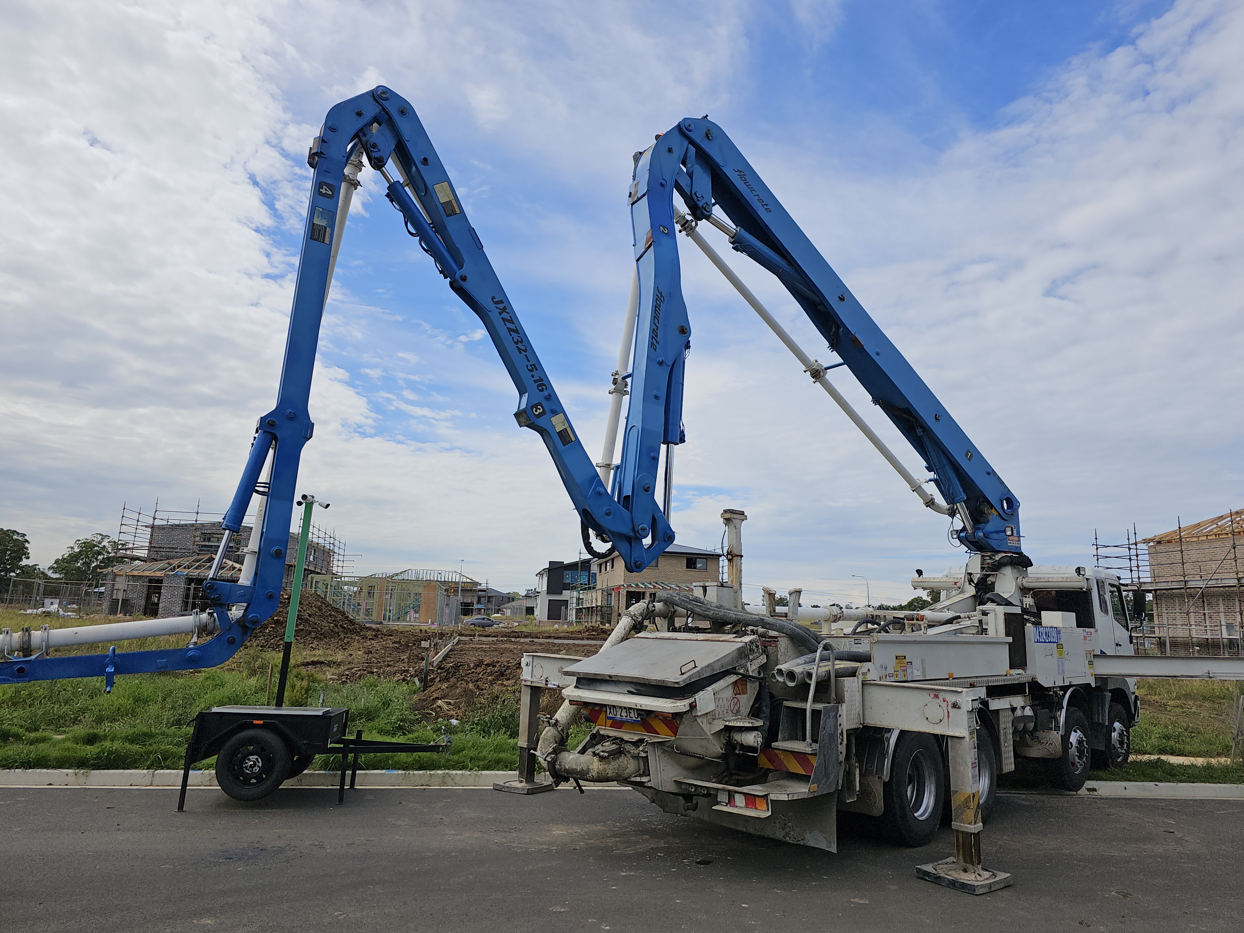 An image of a concrete pump truck on site for a residential Diligent Concrete Group project